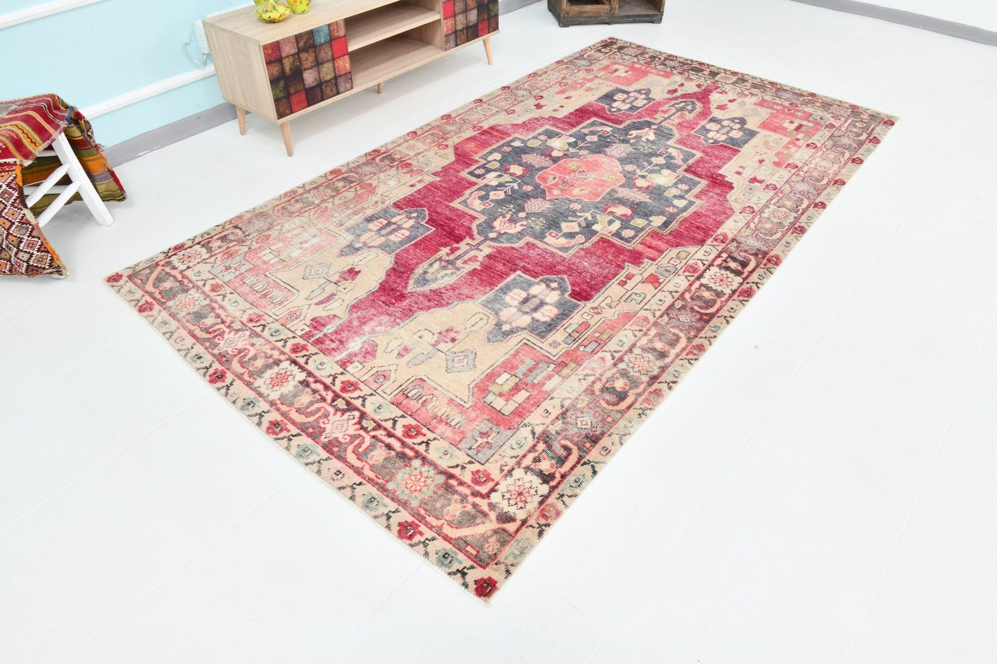 Rectangular red rug with beige and brown floral pattern. 5’ x 10’ Turkish Vintage Rug -