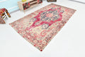 Rectangular red rug with beige and brown floral pattern. 5’ x 10’ Turkish Vintage Rug -